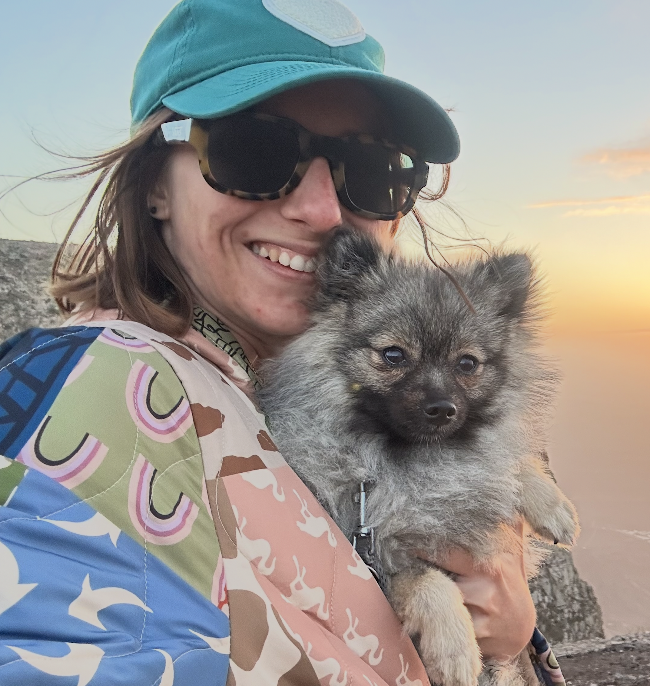 Sunset view with a small dog and people in the background